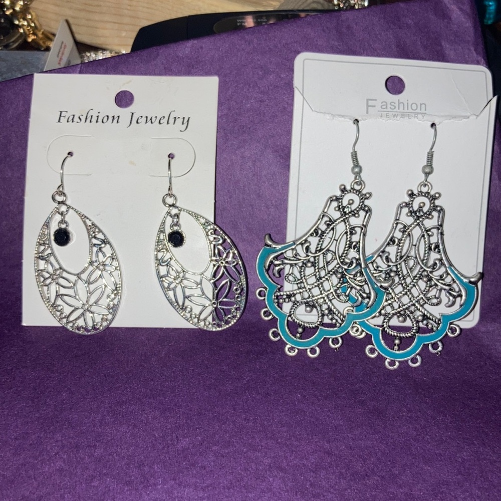Two sets of new on card bohemian style earrings in silvertone